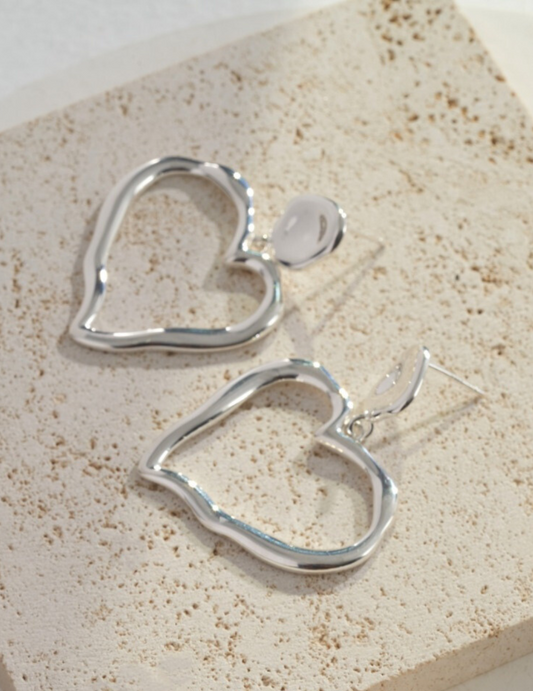 Unstoppable Beat: Luxurious Asymmetrical Heart-Shaped Sterling Silver Earrings