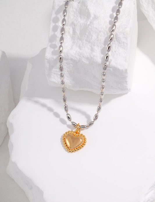 Gleaming Affection: Stylish Sterling Silver Necklace with Vintage Gold Heart Pendant