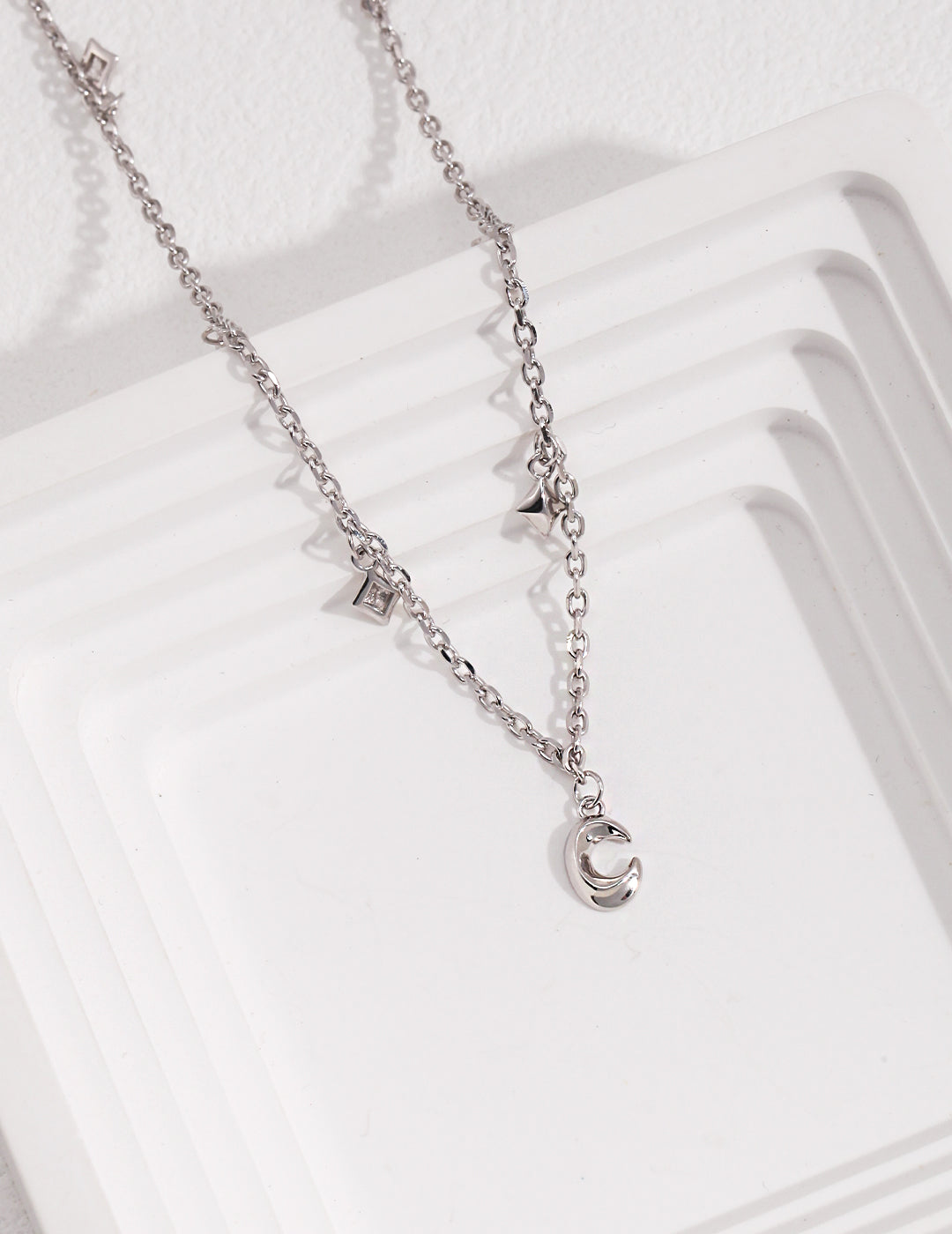 Chic Sterling Silver Necklace with Star and Moon Accents