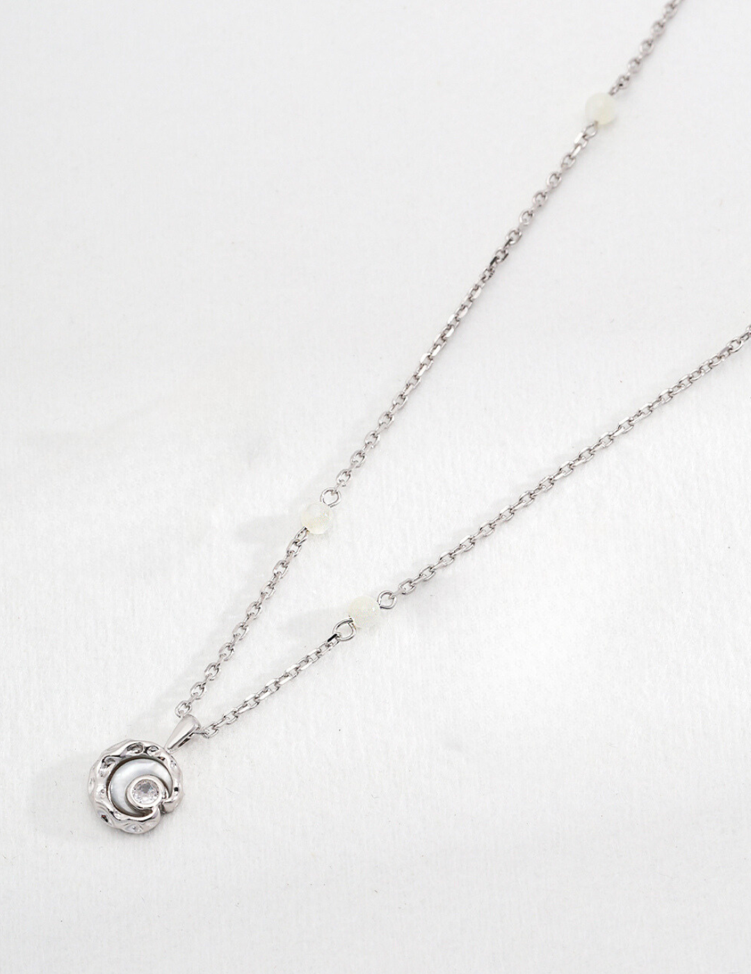 Time Axis: Elegant Mother-of-Pearl and Zircon Pendant Necklace in Sterling Silver